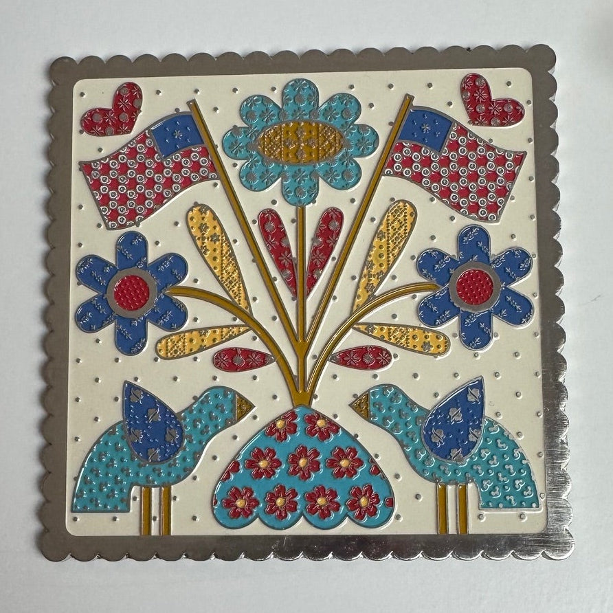 American Themed magnetic needle and scissor minder with flags, flowers and birds.