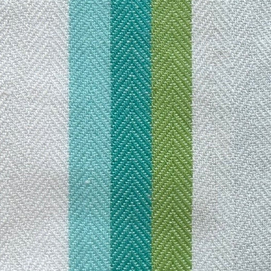 White towel with green stripe on a wooden surface