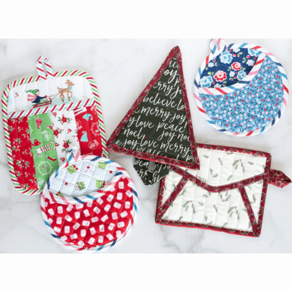 Set of fabric potholders with various patterns on a white background