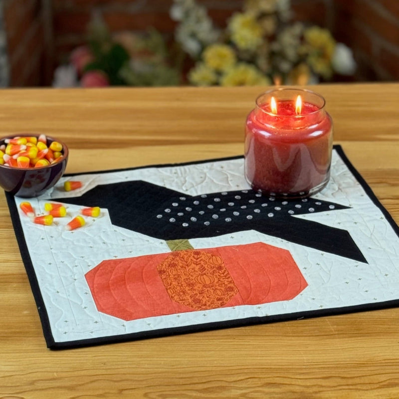Decorative fall autumn quilted mat kit with raven atop a pumpkin