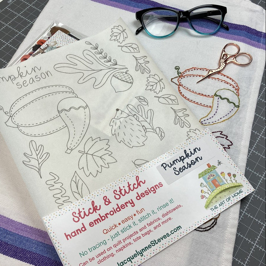 Stick & Stitch hand embroidery designs with pumpkin season theme on a fabric sheet.