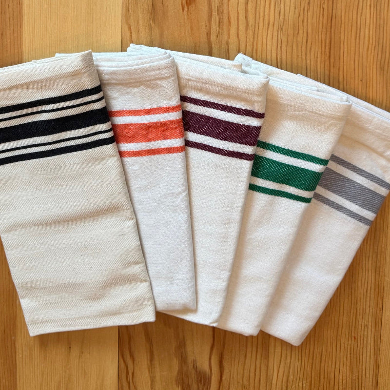 Striped colorful tea towels on wood table