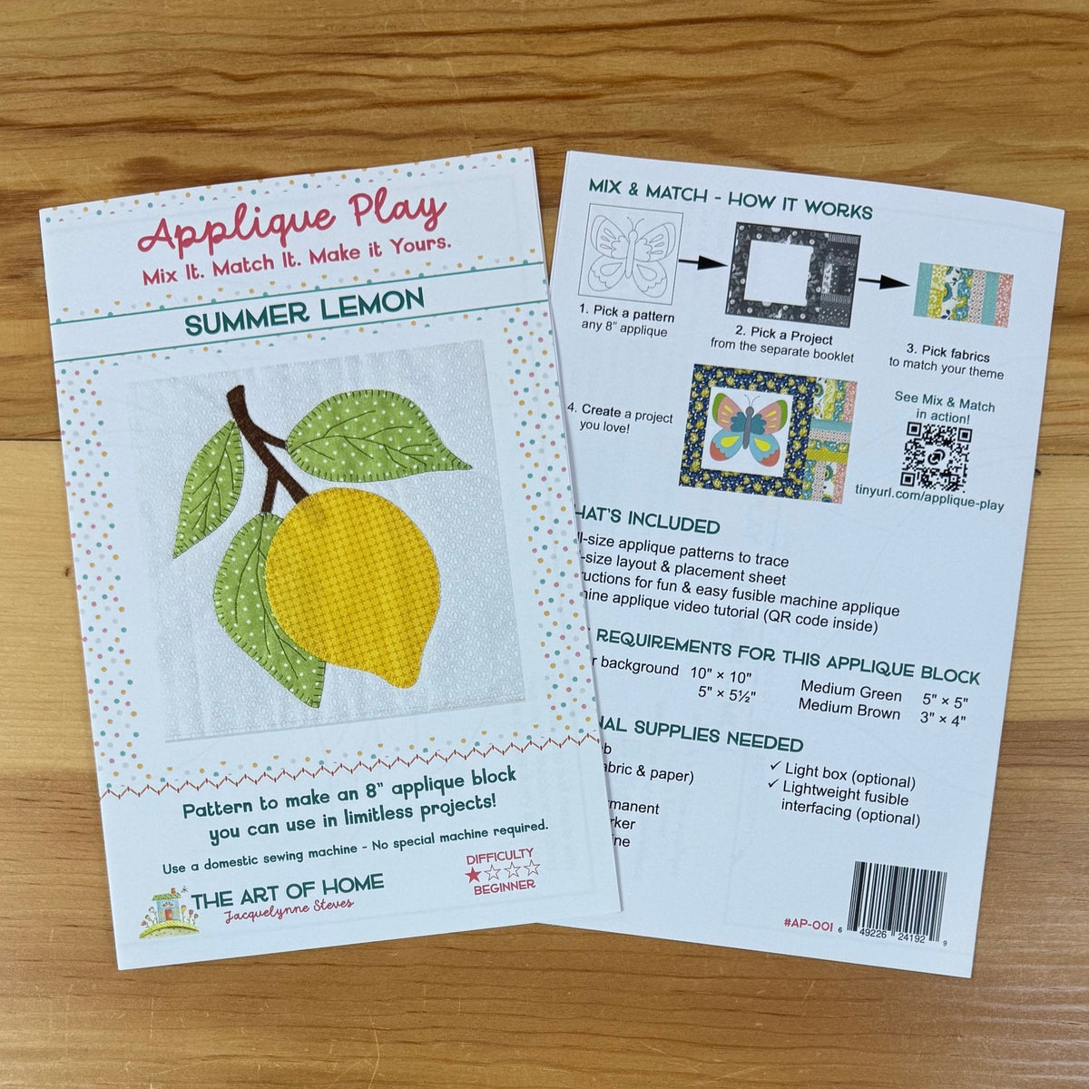 Front and back cover for 'Applique Play' pattern mixing instructions and a sample card for a 'Summer Lemon' applique design, displayed on a light wood surface.