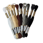 Set of embroidery threads on a white surface