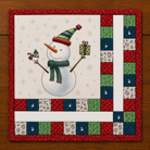 Mini quilt of snowman holding bird and present with patchwork edges.
