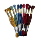Set of embroidery threads in various colors on a light gray background