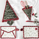 Set of Christmas-themed potholders and kitchen utensil holder on a white background