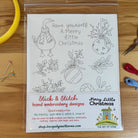 Christmas embroidery designs featuring a goose, balls, mistletoe and holly.  Stick & Stitch embroidery sheet on wood table surrounded by sewing notions