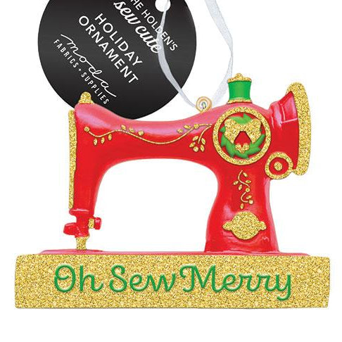 Decorative sewing machine ornament with 'Oh Sew Merry' text on a white background