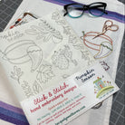 Stick & Stitch hand embroidery designs with pumpkin season theme on a fabric sheet.